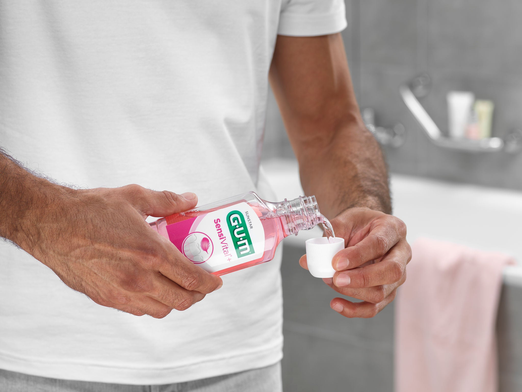 In-context-GUM-SensiVital-Mouthwash-Close-Up-while-Man-is-Pouring.jpg