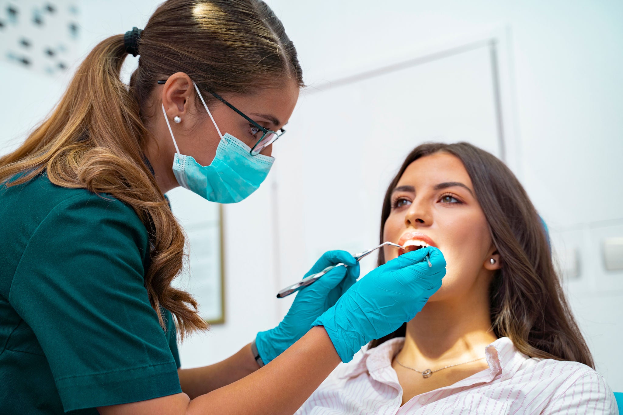 OCP-Dentist-woman-with-mask-during-the-treatment-for-her-patient