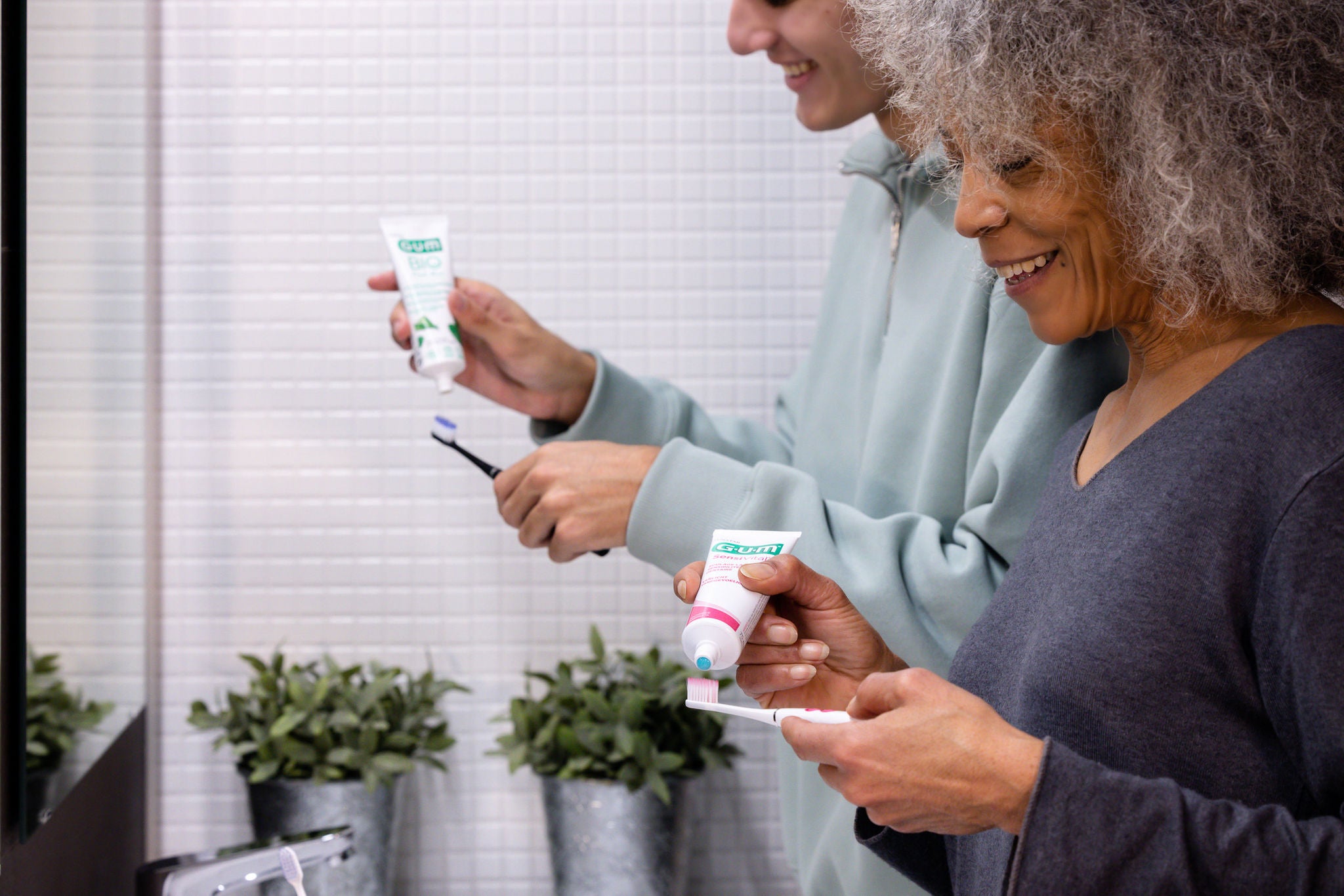 In-context-GUM-SensiVital-Plus-BIO-TPs-young-man-and-woman-brushing-teeth-v1