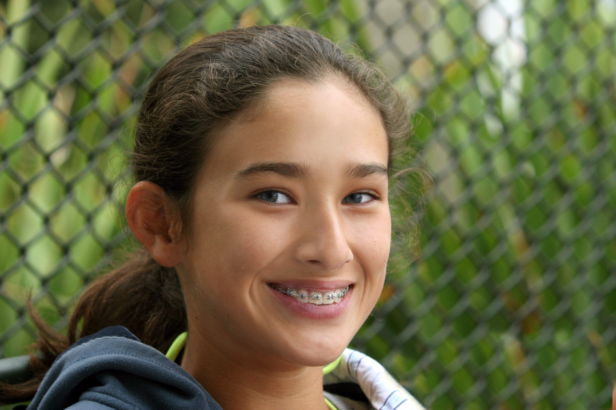 Girl-with-braces-and-brown-hair-smiling