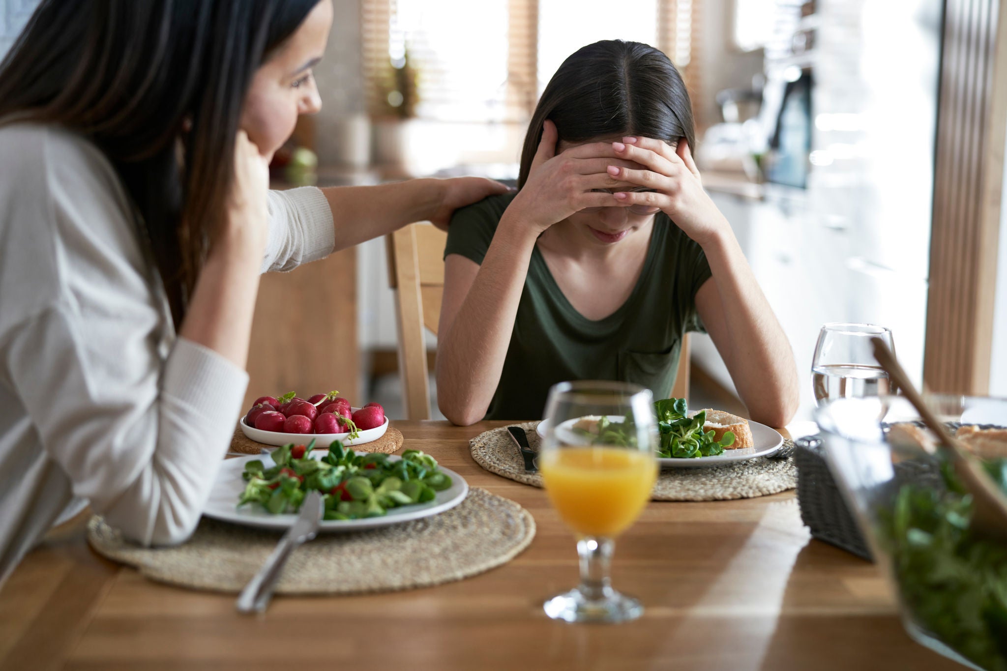 Woman-supporting-her-daughter-with-eating-disorders