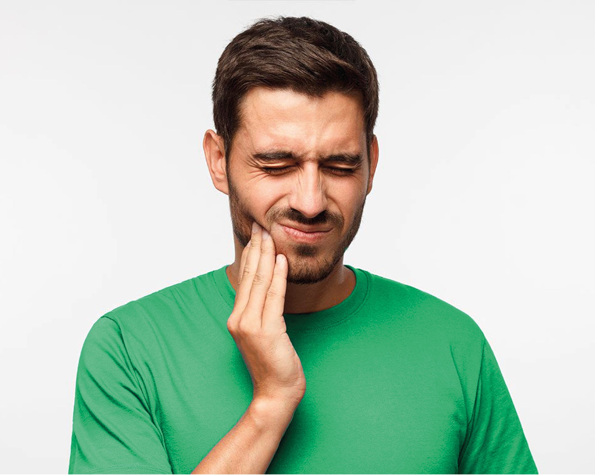 Man-with-toothache-green-t-shirt-brown-hair
