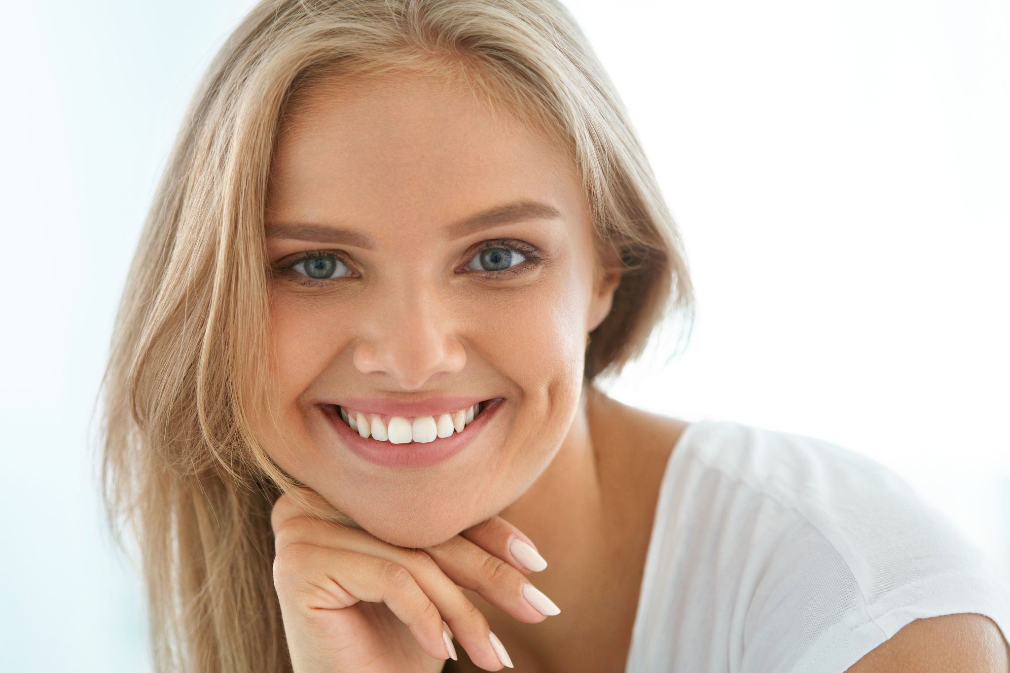 Beautiful Woman Smiling. Portrait Of Attractive Happy Healthy Girl With Perfect Smile, White Teeth, Blonde Hair And Fresh Face Smiling Indoors. Beauty And Health Concept. High Resolution Image